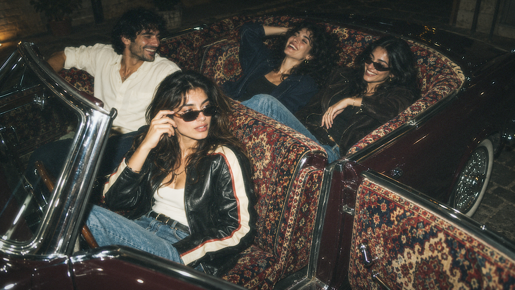 Friends in a vintage car with Persian carpet upholstery
